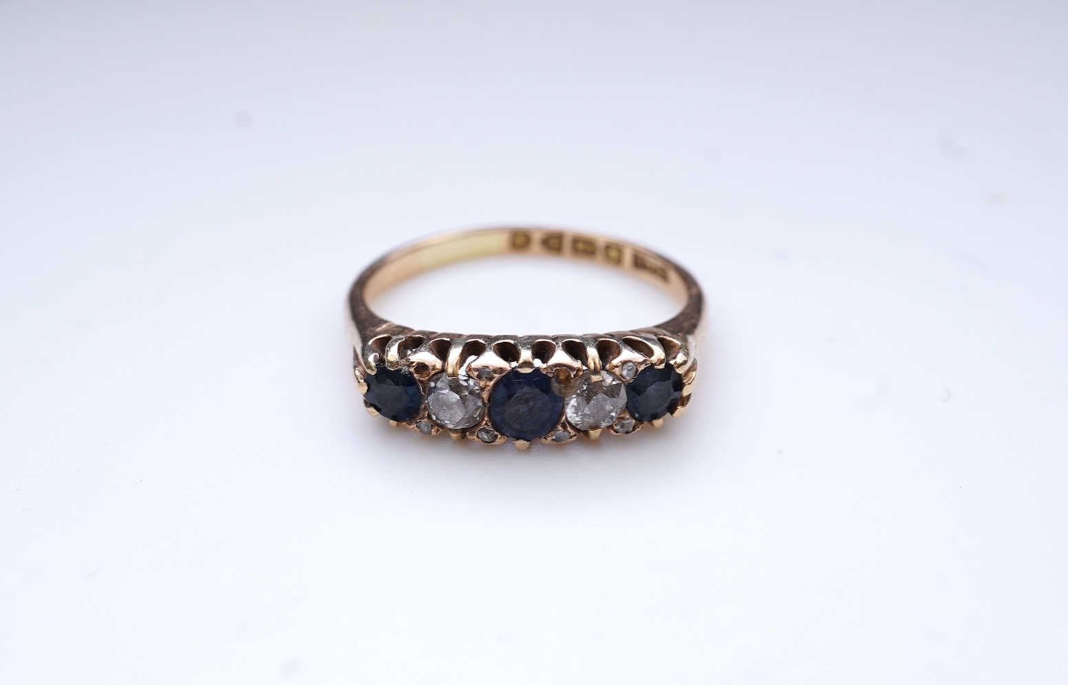 A sapphire and diamond five-stone ring, circa 1902